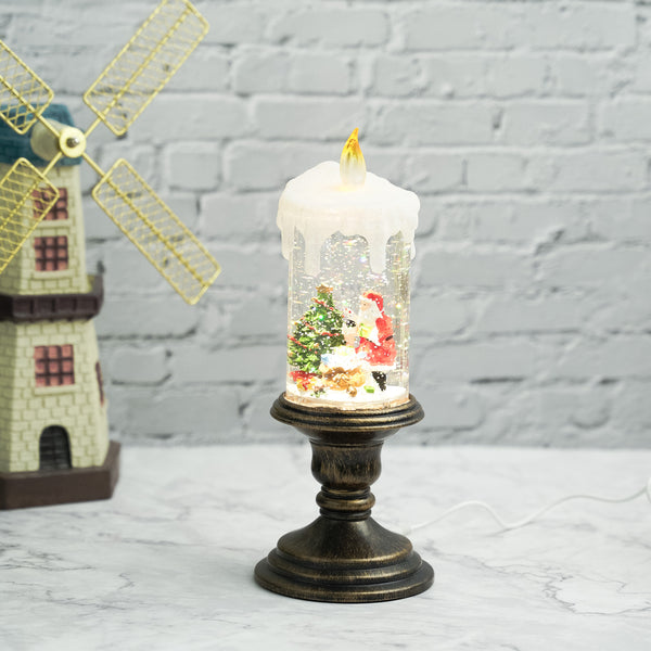 Holiday decorations, beautiful christmas snowglobe candle with lights and music, santa with reindeers by Sona Casa