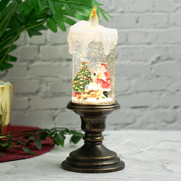 Holiday decorations, beautiful christmas snowglobe candle with lights and music, santa with reindeers by Sona Casa