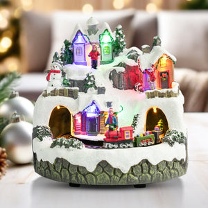 Illuminated Musical Christmas Village Set With Animated Carousel, Train Station & Figurines, LED Light-Up White Houses, Holiday Tabletop Decor by Sona Casa
